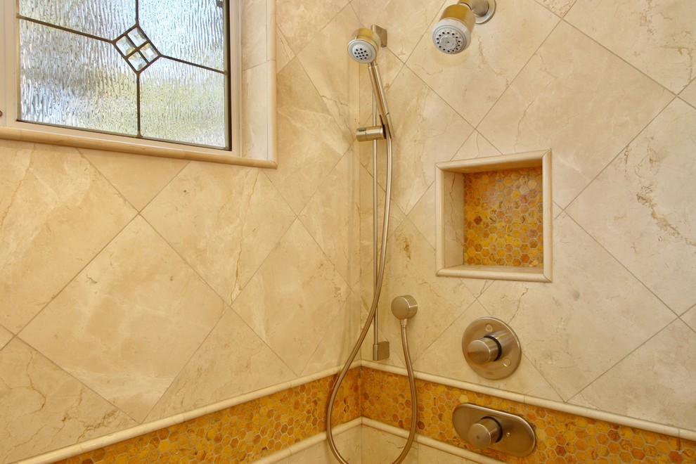 Contemporary bathroom in San Diego with an alcove shower, beige tile, stone tile and marble floors.