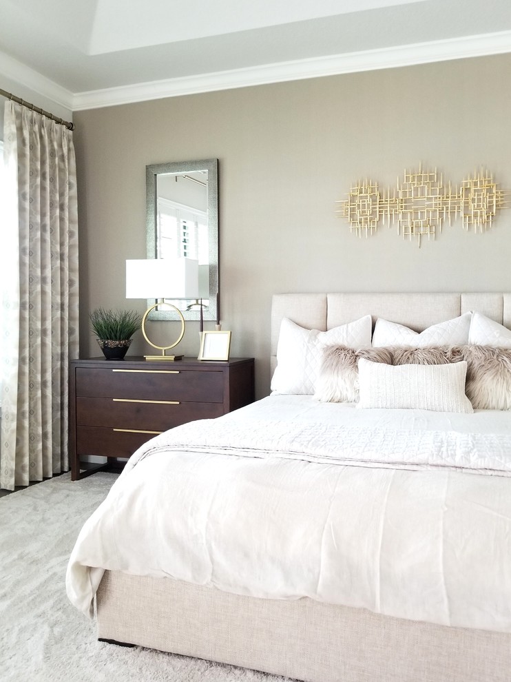 Inspiration for a transitional bedroom in Orlando with beige walls and no fireplace.