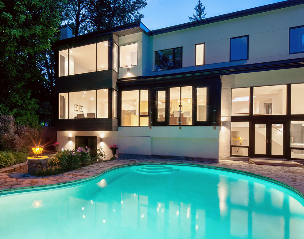 Photo of a contemporary custom-shaped pool in Ottawa.