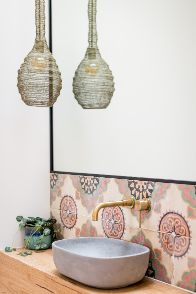 Inspiration for an eclectic powder room remodel in Geelong