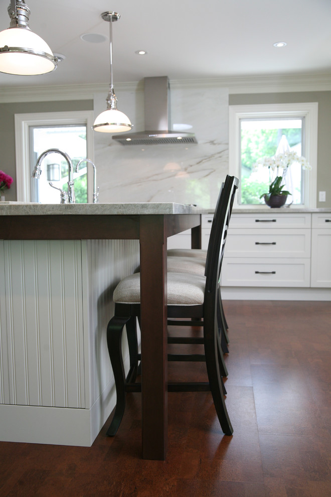 Large transitional l-shaped dark wood floor and brown floor eat-in kitchen photo in Toronto with an undermount sink, shaker cabinets, white cabinets, stainless steel appliances and an island