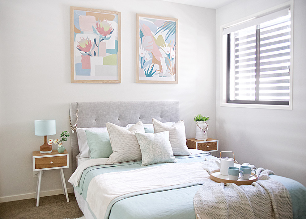 Inspiration for a mid-sized transitional guest bedroom in Brisbane with grey walls, carpet and beige floor.