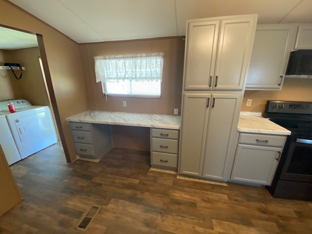 Eat-in kitchen - large l-shaped eat-in kitchen idea with a drop-in sink, flat-panel cabinets, gray cabinets, laminate countertops, no island and white countertops