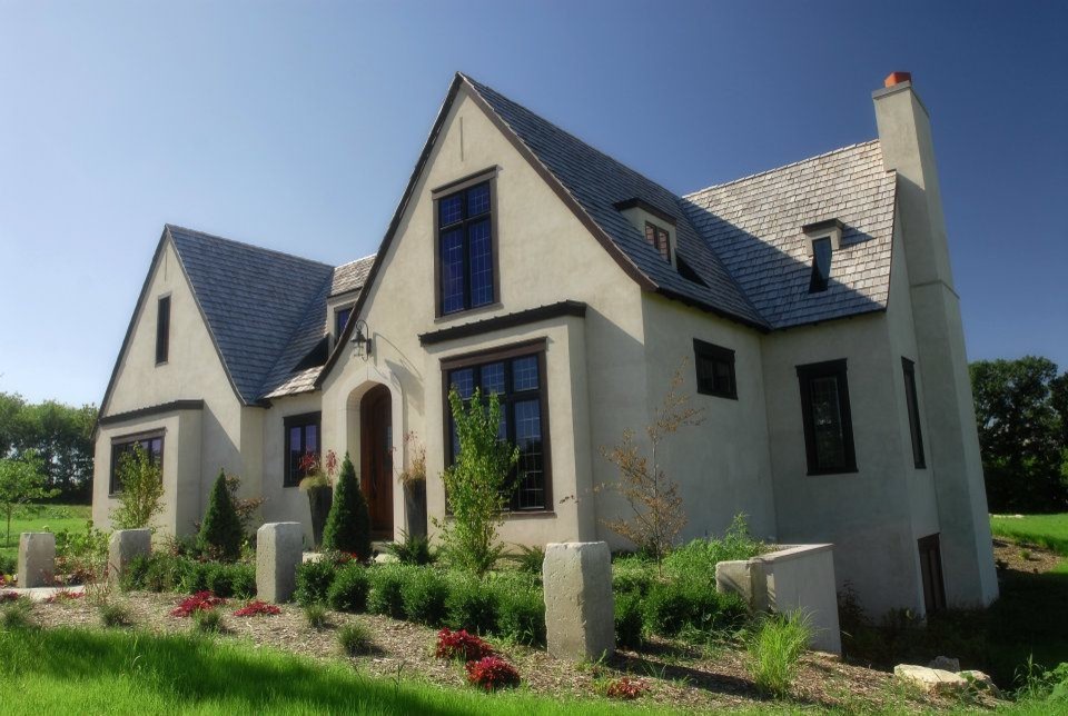 Rustic beige two-story stucco exterior home idea