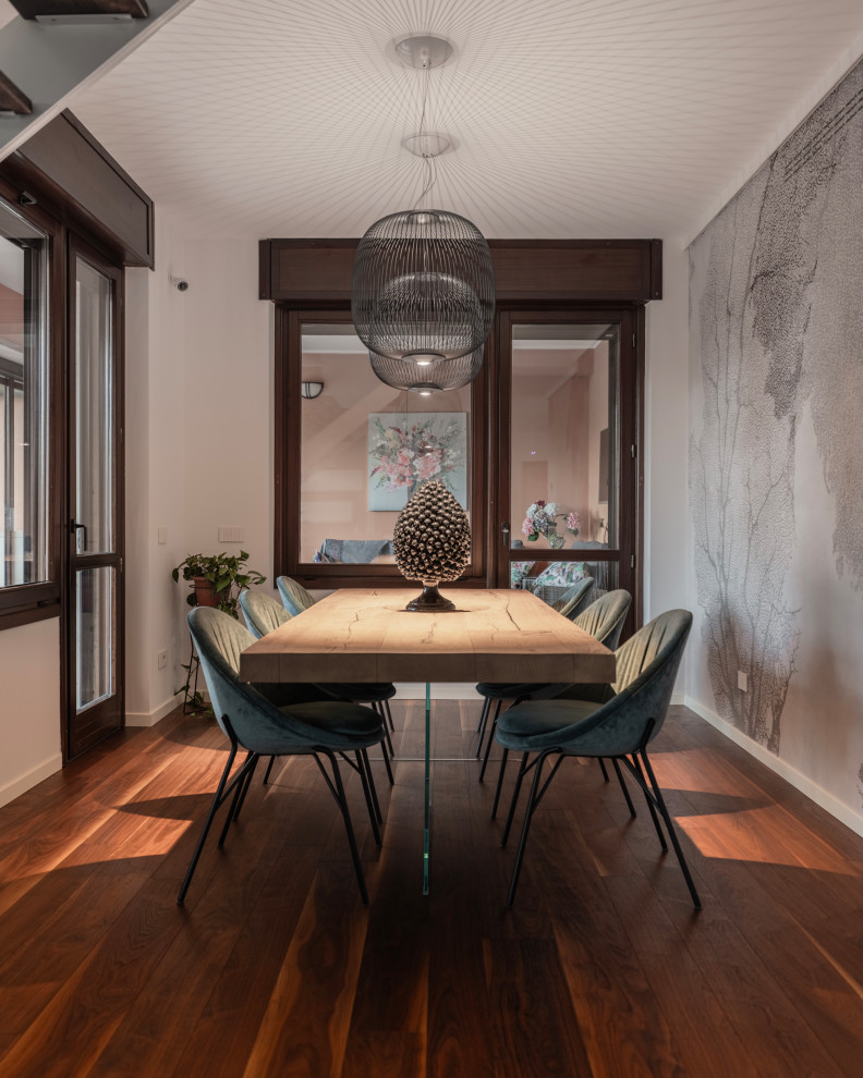 Mid-sized modern open plan dining in Milan with white walls, dark hardwood floors, brown floor, recessed and wallpaper.