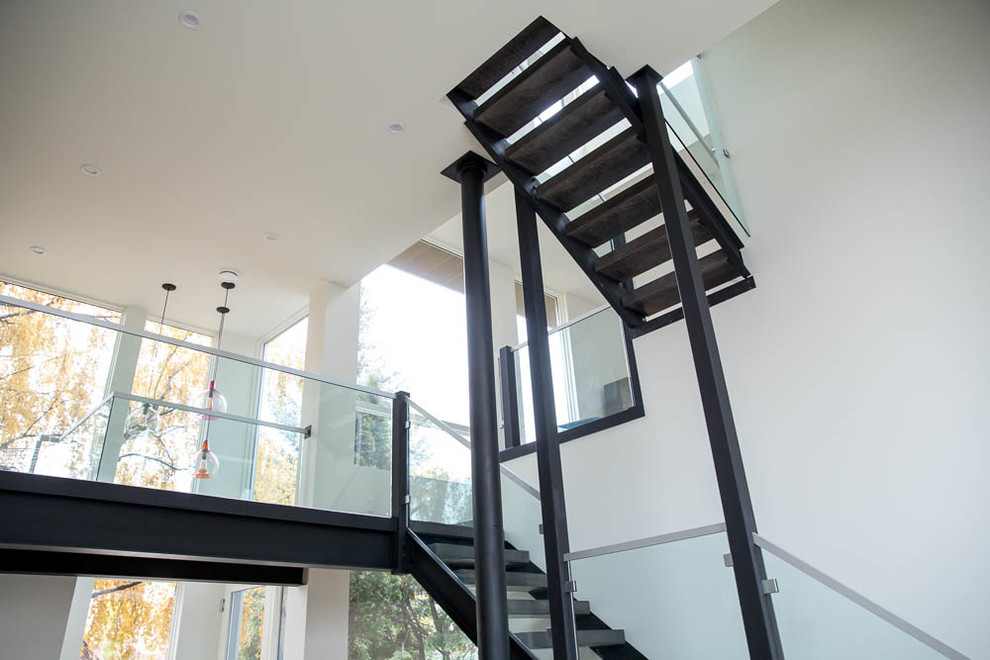 Mid-sized modern staircase in Calgary.