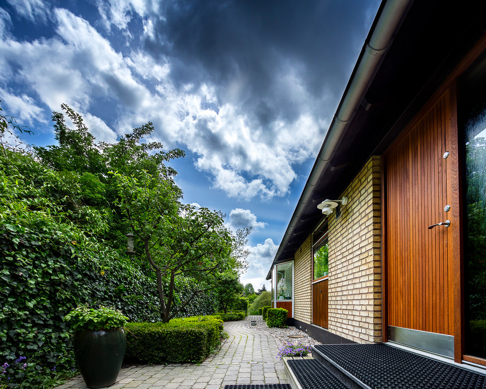 Home design - large transitional one-story wood red home design idea in Aarhus