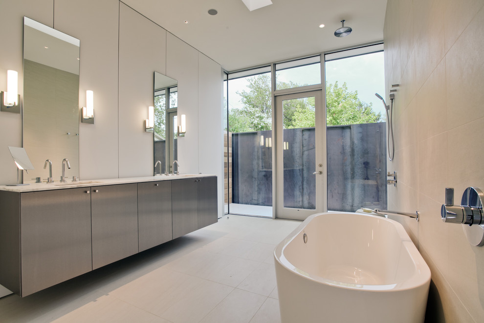 This is an example of a modern bathroom in Dallas with an open shower, a freestanding tub and an open shower.