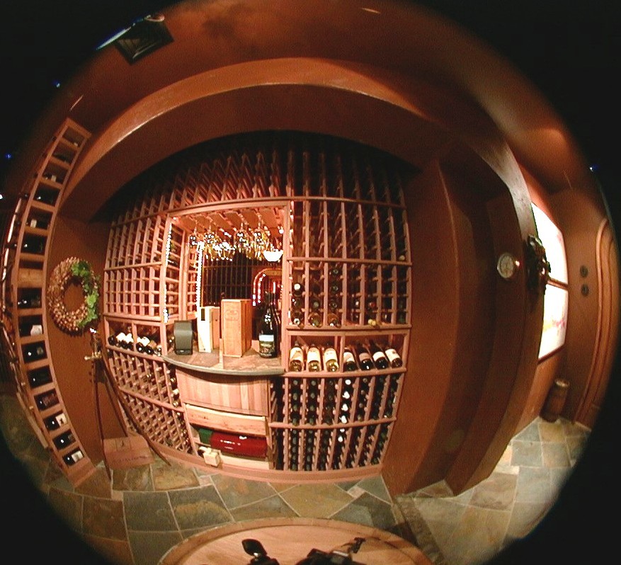 Inspiration for a large transitional wine cellar in San Francisco with display racks and slate floors.
