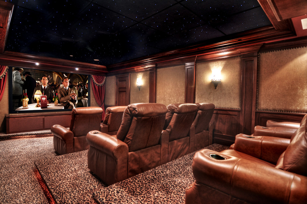Large mediterranean enclosed home theatre in Orange County with brown walls, carpet, a built-in media wall and multi-coloured floor.