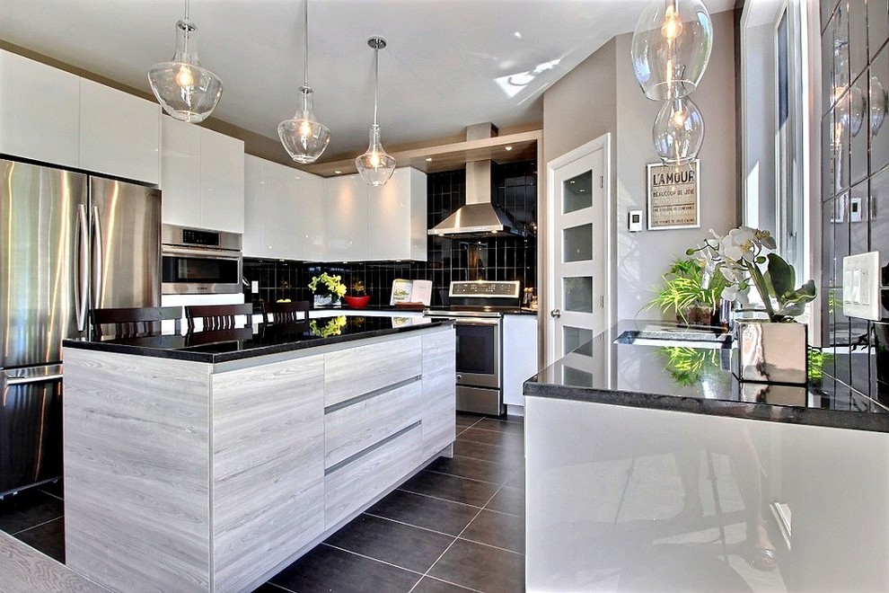 Mid-sized contemporary l-shaped eat-in kitchen in Montreal with a double-bowl sink, beaded inset cabinets, white cabinets, granite benchtops, black splashback, ceramic splashback, stainless steel appliances, light hardwood floors, with island and brown floor.