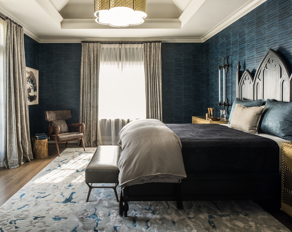Inspiration for a transitional master bedroom in San Francisco with blue walls, medium hardwood floors and brown floor.