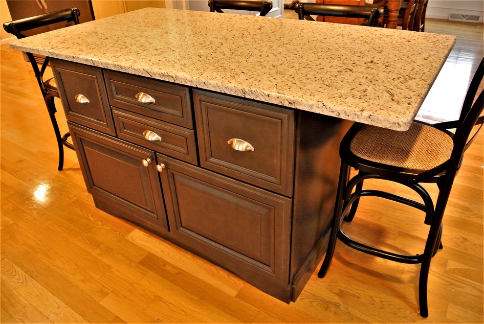 Inspiration for a transitional light wood floor eat-in kitchen remodel in Boston with granite countertops and an island