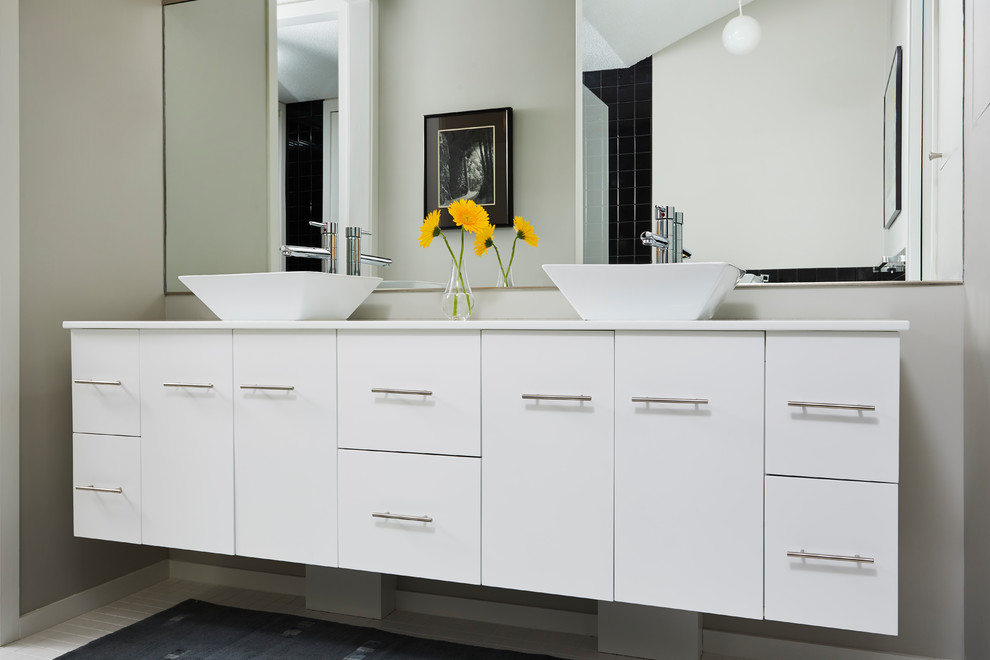 Mid-sized contemporary master bathroom in Minneapolis with flat-panel cabinets, white cabinets, a japanese tub, an alcove shower, a one-piece toilet, grey walls, ceramic floors, a vessel sink, granite benchtops, white floor and an open shower.