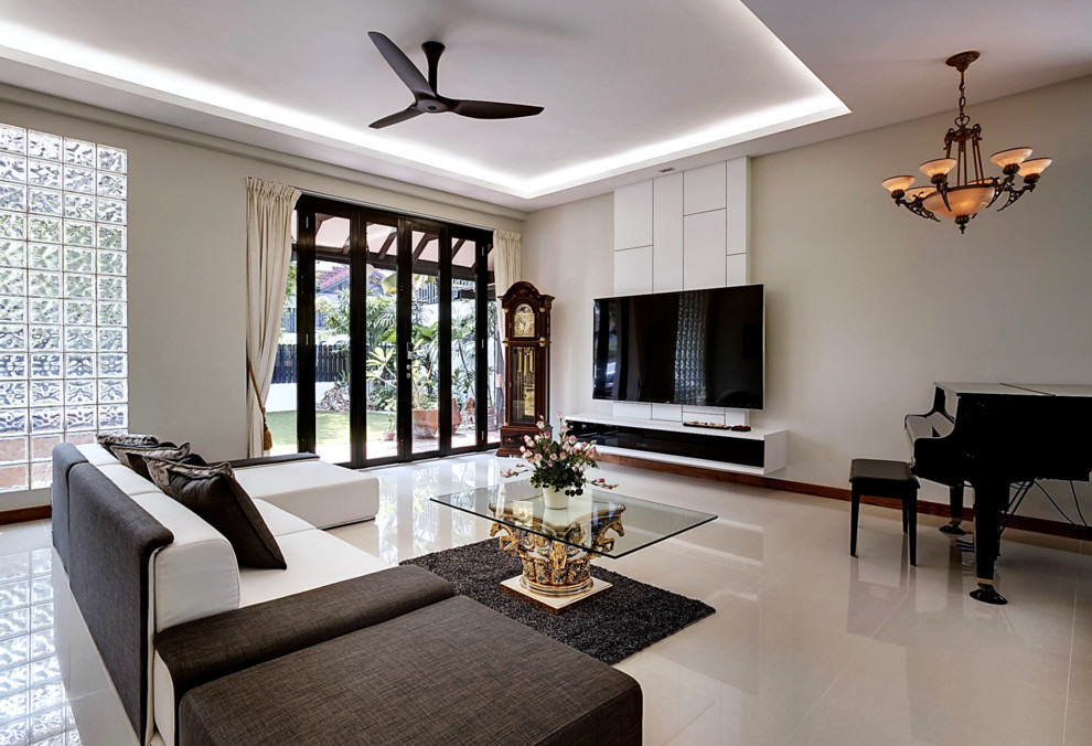 Photo of a mid-sized asian open concept living room in Singapore with a wall-mounted tv.