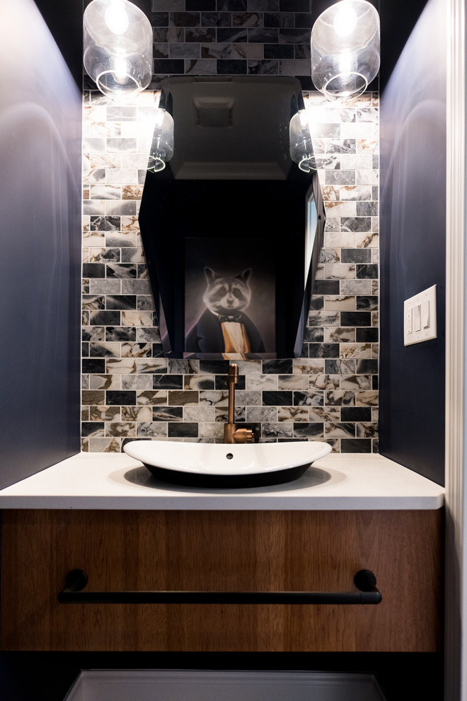 Mid-sized trendy dark wood floor powder room photo in Indianapolis with flat-panel cabinets, medium tone wood cabinets, multicolored walls, a vessel sink and a built-in vanity