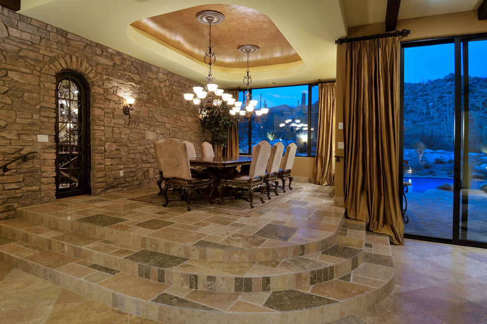 Inspiration for a dining room in Phoenix with travertine floors.