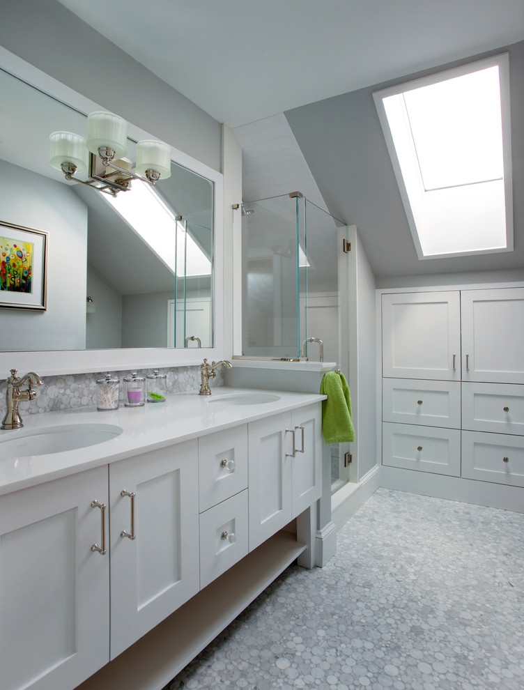 Mid-sized transitional bathroom in Boston with shaker cabinets, white cabinets, a corner shower, grey walls, an undermount sink, mosaic tile floors, engineered quartz benchtops, a hinged shower door and white benchtops.