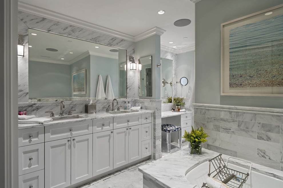 Inspiration for a large transitional master bathroom in Boston with recessed-panel cabinets, an undermount sink, white cabinets, an undermount tub, gray tile and grey walls.