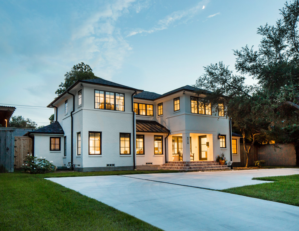 Large transitional two-storey brick white house exterior in Dallas with a hip roof and a shingle roof.
