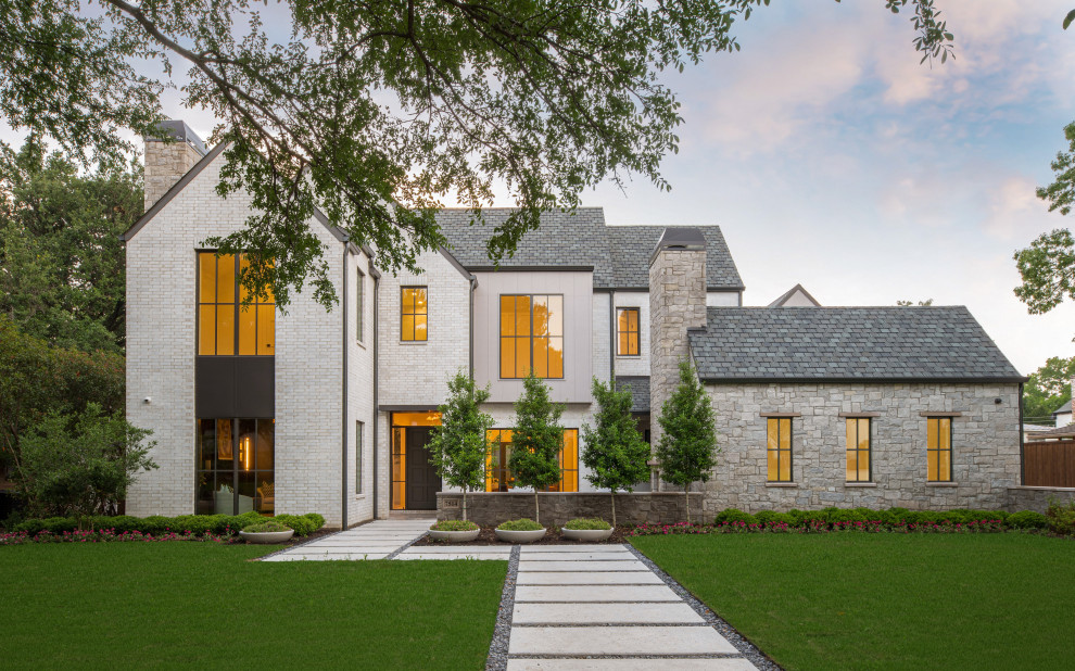 Transitional white two-story brick exterior home idea in Dallas with a shingle roof and a gray roof