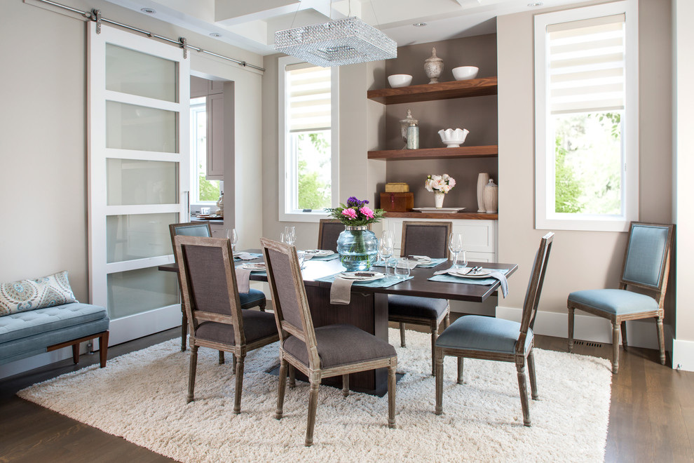 Inspiration for a mid-sized transitional separate dining room in Calgary with beige walls and vinyl floors.