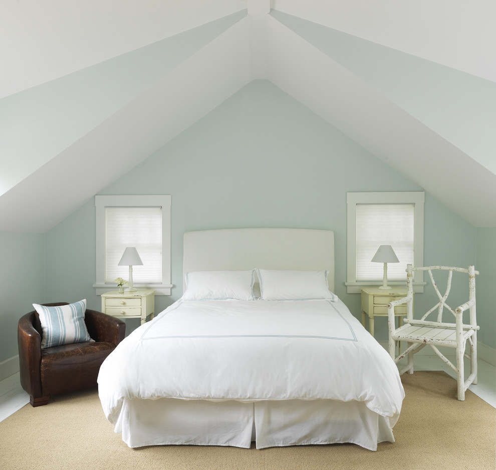 Traditional bedroom in Providence with blue walls, painted wood floors and no fireplace.
