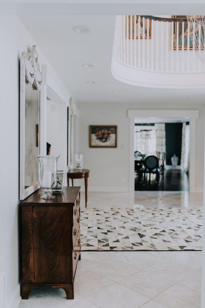 Transitional dark wood floor and brown floor entryway photo in Cleveland with blue walls