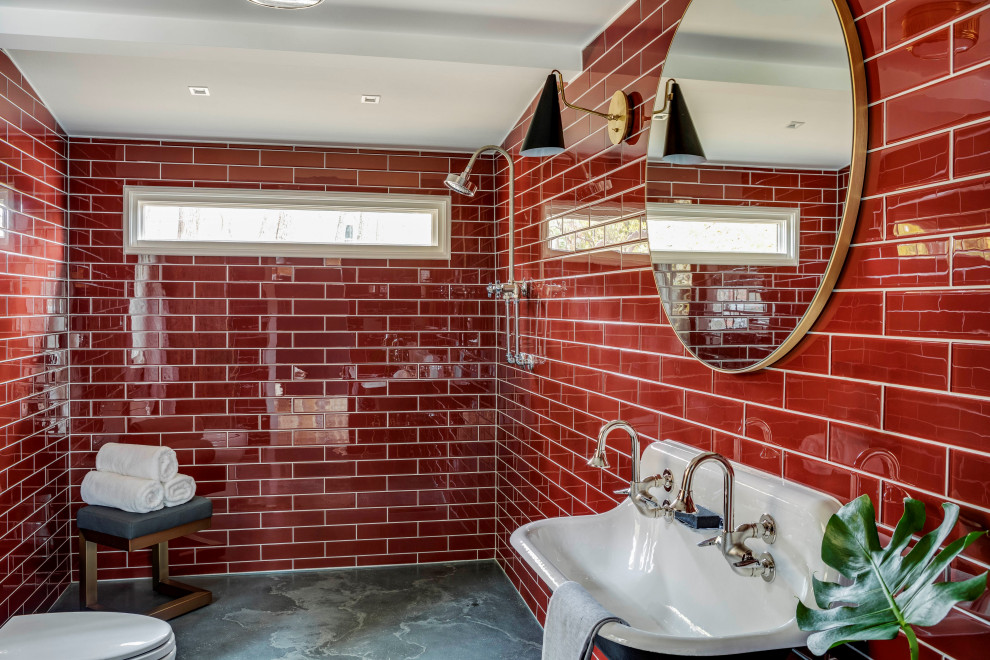 Inspiration for a small country bathroom in Boston with a curbless shower, red tile, glass tile, concrete floors, a wall-mount sink, an open shower, grey floor and a double vanity.