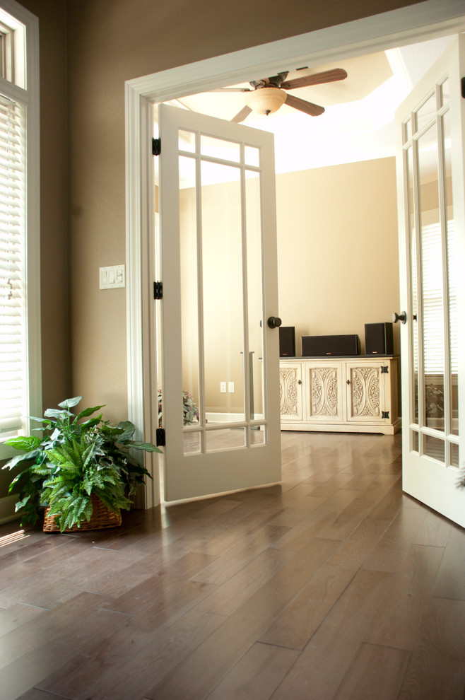 Hallway - mid-sized transitional brown floor hallway idea with beige walls