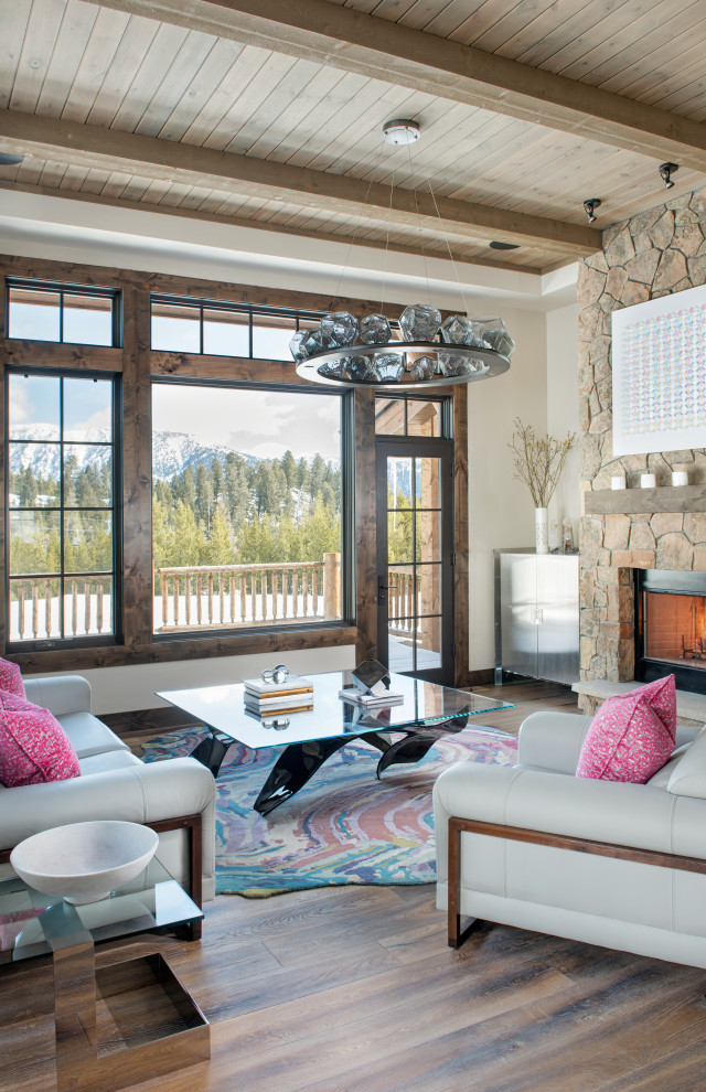 Inspiration for a mid-sized contemporary open concept living room with medium hardwood floors, a standard fireplace, a stone fireplace surround, brown floor and wood.