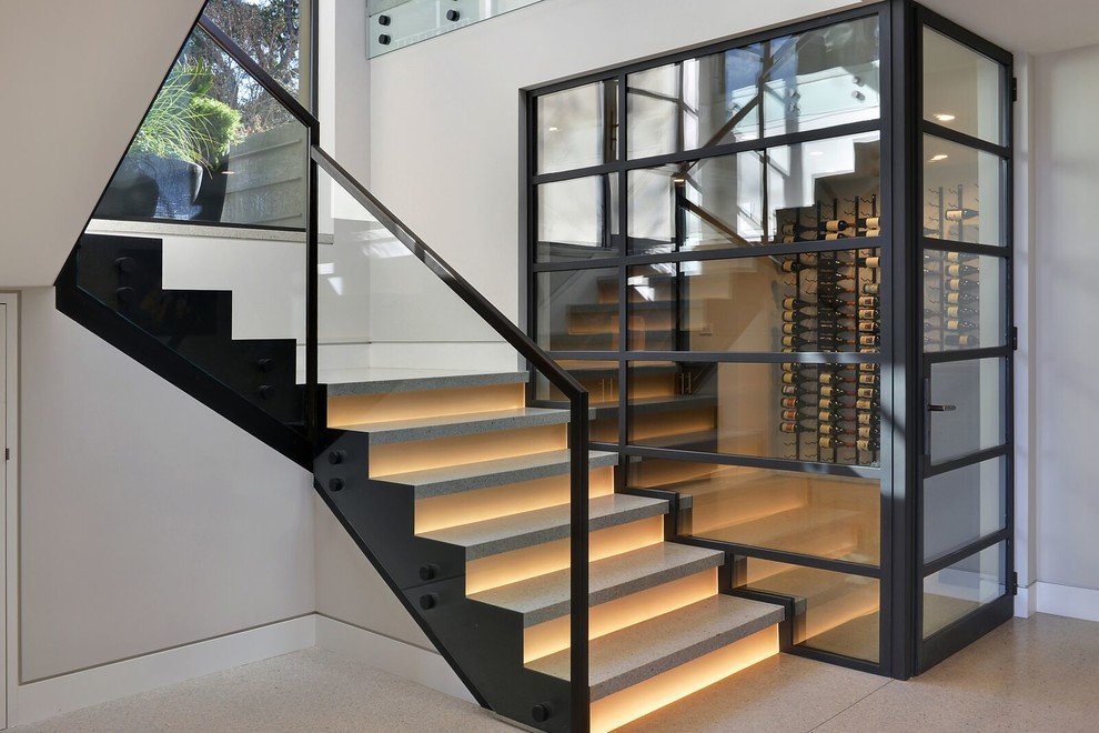 Inspiration for a large contemporary u-shaped staircase in Austin with metal railing.