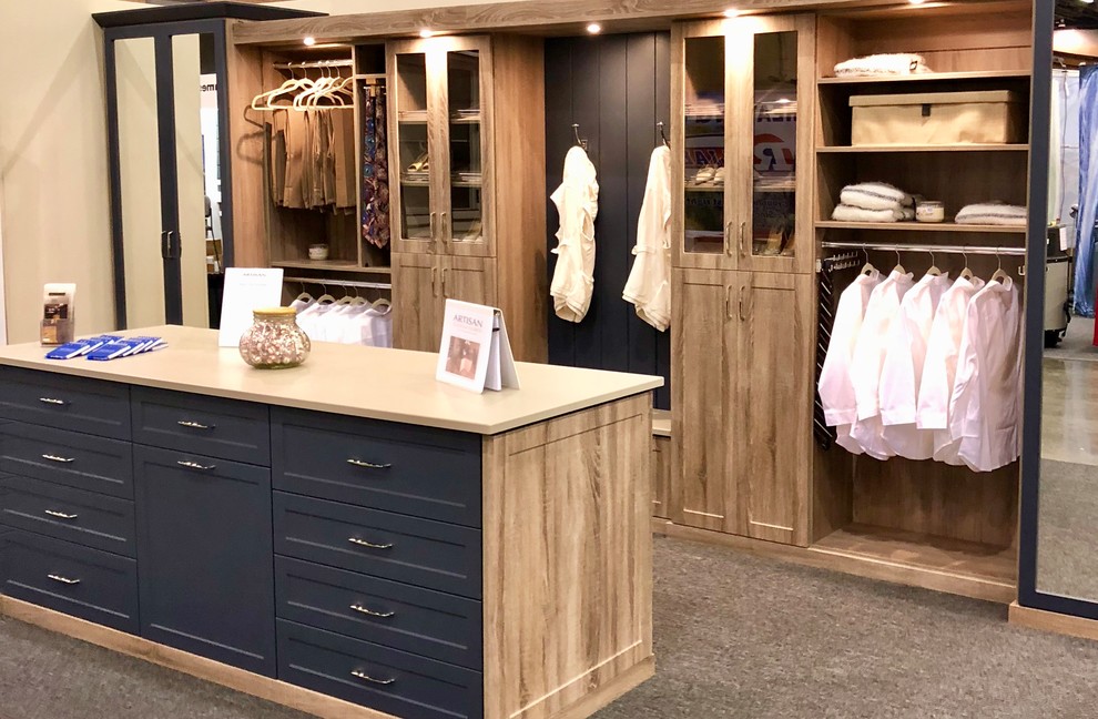 Design ideas for a large transitional gender-neutral dressing room in Atlanta with shaker cabinets, medium wood cabinets, carpet and brown floor.