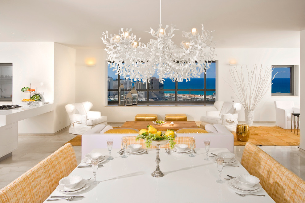 Inspiration for a contemporary dining room in Other with white walls, marble floors and beige floor.