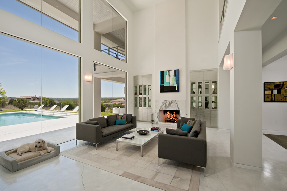 This is an example of a contemporary living room in Austin with white walls.