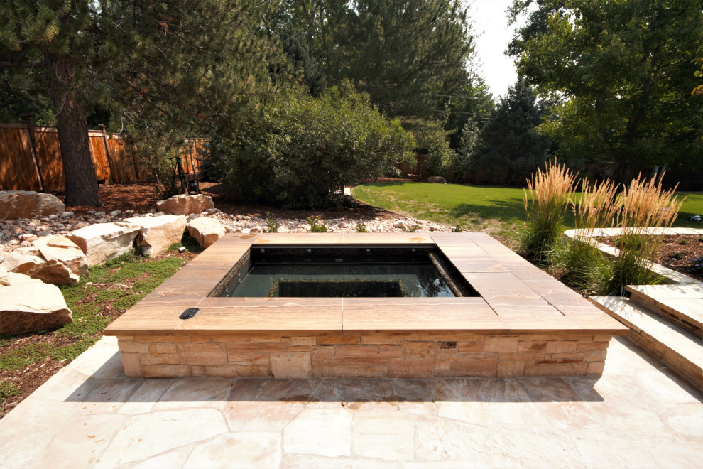 Inspiration for a small backyard rectangular aboveground hot tub remodel in Denver