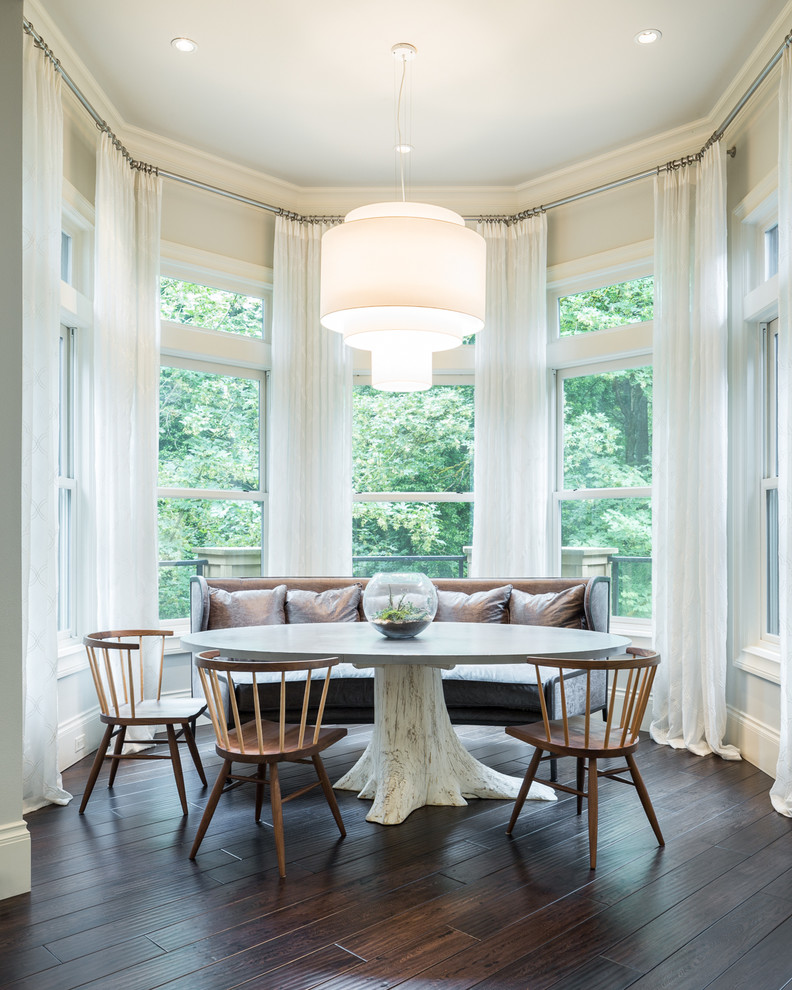 Transitional dining room in Portland with white walls and dark hardwood floors.