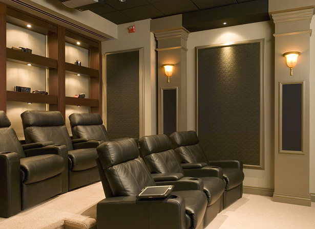 Mid-sized traditional enclosed home theatre in Other with beige walls and carpet.