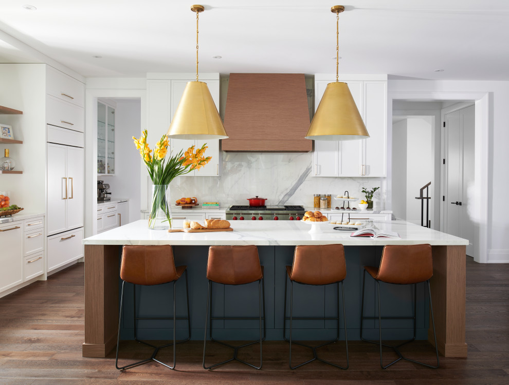 Inspiration for a large contemporary l-shaped eat-in kitchen in Toronto with a double-bowl sink, shaker cabinets, white cabinets, marble benchtops, white splashback, marble splashback, stainless steel appliances, dark hardwood floors, with island, brown floor, white benchtop and recessed.