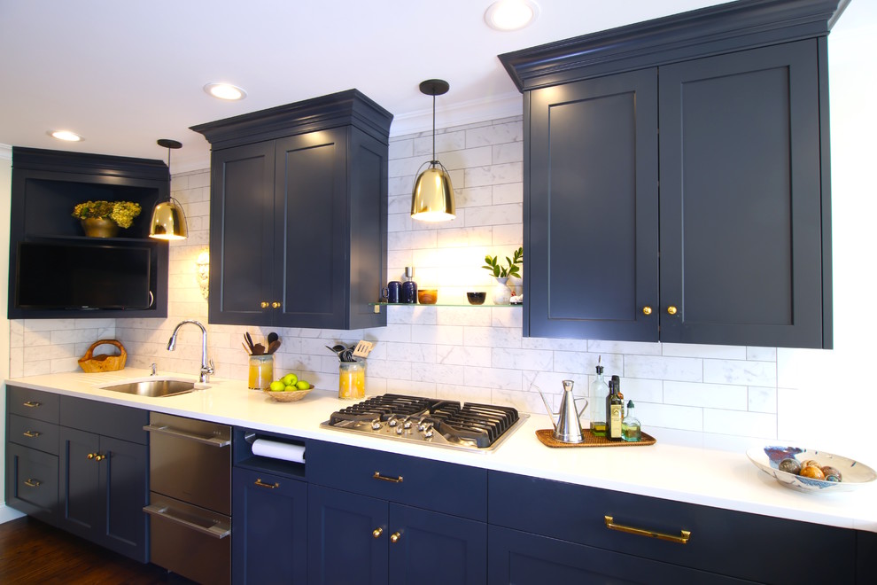 Inspiration for a mid-sized modern galley separate kitchen in Bridgeport with an undermount sink, recessed-panel cabinets, blue cabinets, limestone benchtops, white splashback, porcelain splashback, stainless steel appliances, dark hardwood floors and no island.