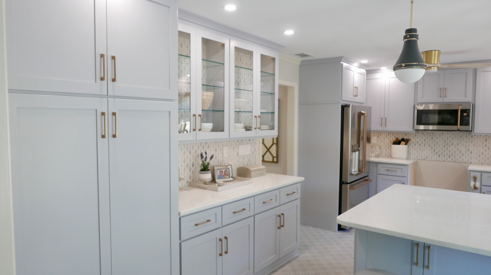 Eat-in kitchen - mid-sized transitional u-shaped ceramic tile and multicolored floor eat-in kitchen idea with a farmhouse sink, shaker cabinets, gray cabinets, quartz countertops, multicolored backsplash, marble backsplash, stainless steel appliances, a peninsula and white countertops