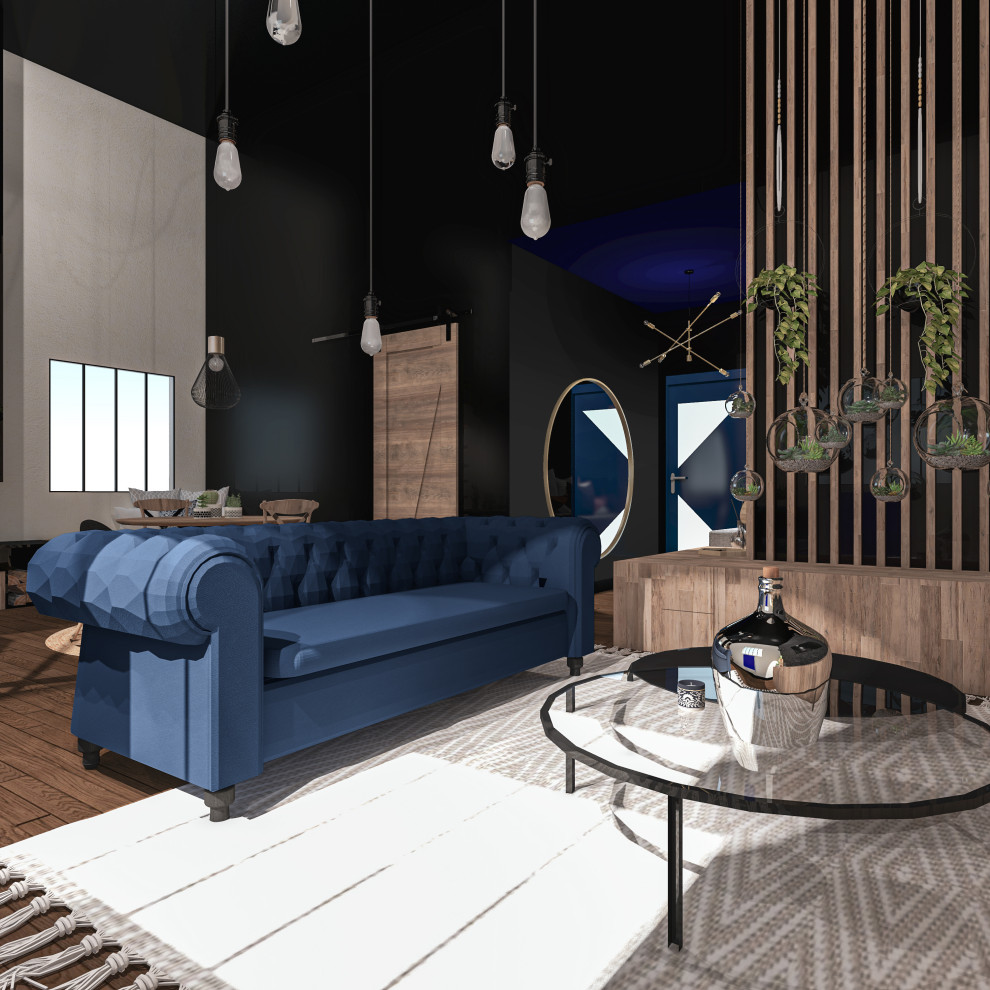 Inspiration for a mid-sized industrial open concept living room in Lyon with a library, black walls, dark hardwood floors, a standard fireplace, a metal fireplace surround, a wall-mounted tv, brown floor and brick walls.