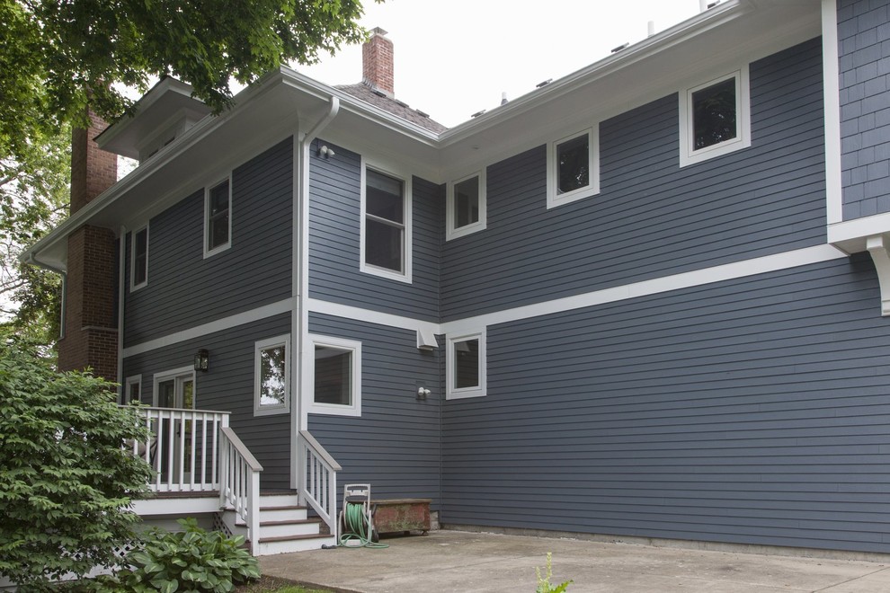 Design ideas for a large traditional two-storey blue exterior in Chicago with concrete fiberboard siding.