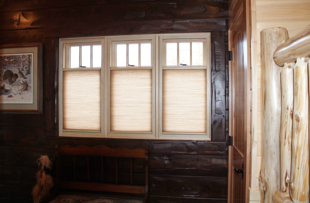 Inspiration for a rustic entryway remodel with brown walls