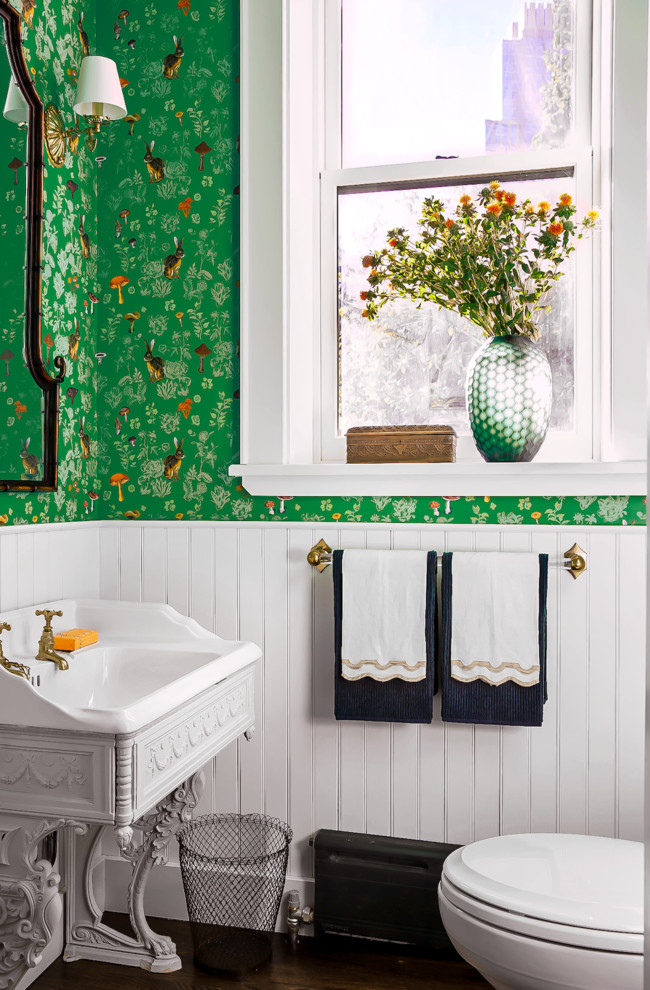 Inspiration for a traditional powder room in New York with green walls, dark hardwood floors, a drop-in sink and brown floor.