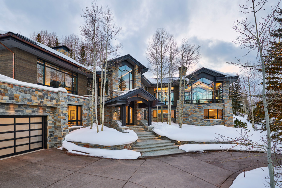 Huge mountain style home design photo in Denver