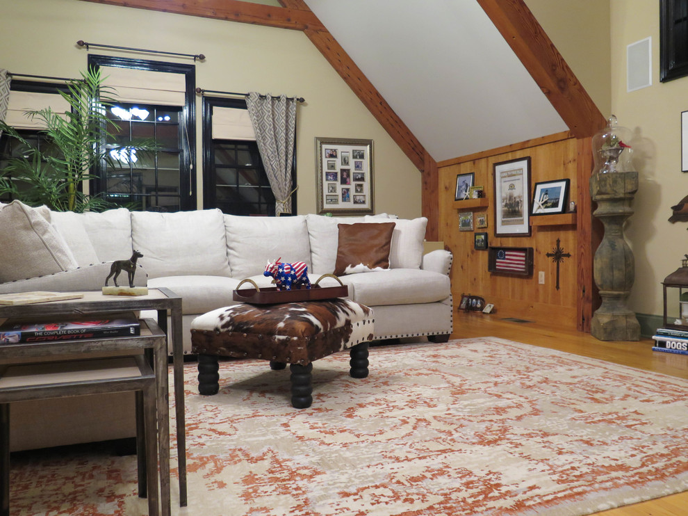 Example of a large mountain style loft-style light wood floor home design design in Bridgeport with beige walls, no fireplace and no tv