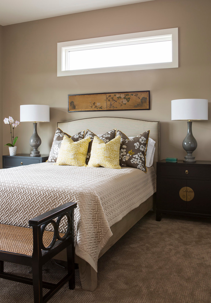 Photo of a transitional bedroom in Minneapolis with brown walls and carpet.