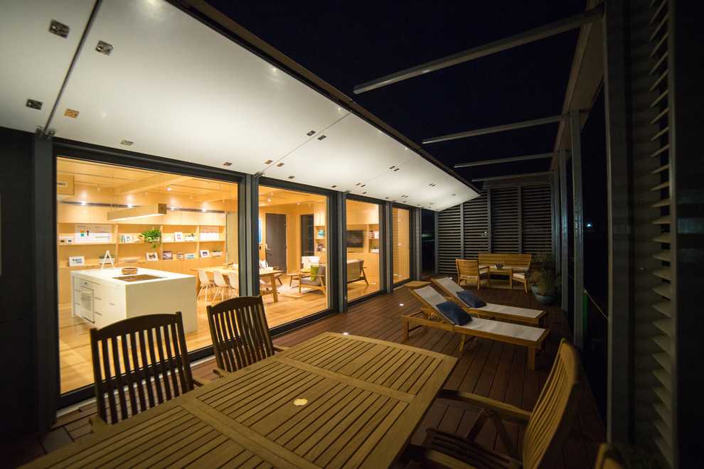 This is an example of a contemporary deck in Houston.
