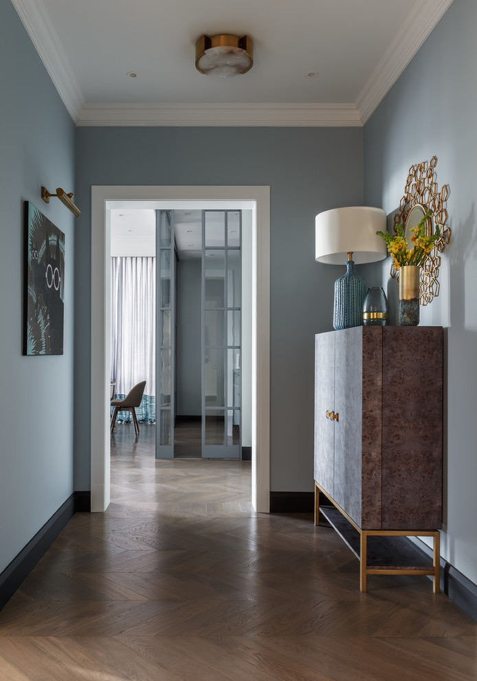 Inspiration for a contemporary hallway in Moscow with grey walls and medium hardwood floors.
